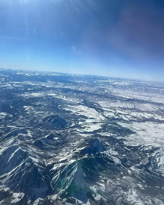 Aerial view of snowy mountains during cross-country flight